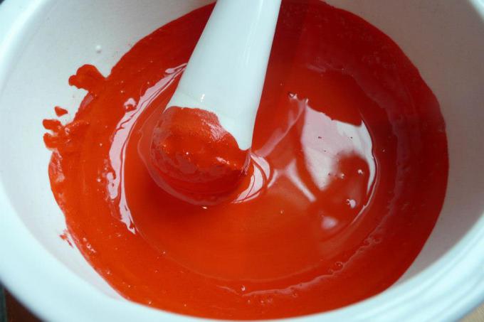 Mipham Namgyal Rinpoche mixes cinnabar in preparation for the calligraphy event.