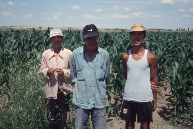 A former Mongolian farmer stands in his corn fields on the Ordos Plateau former mongolian nomads in their fields
