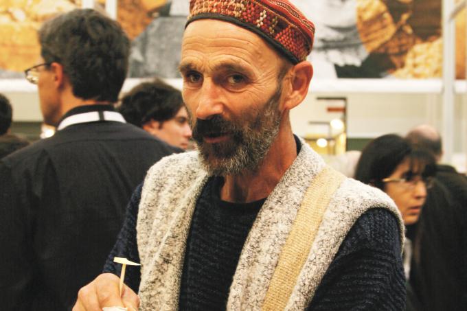 A sardinian shepherd samples Trace Foundation supported Tibetan Yak Cheese