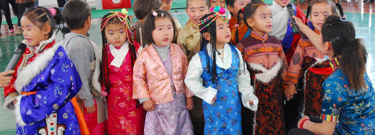 Standing anxiously before a gathering of family and friends, the students at this new Tibetan-language kindergarten in Xining perform folk songs in traditional dress.
